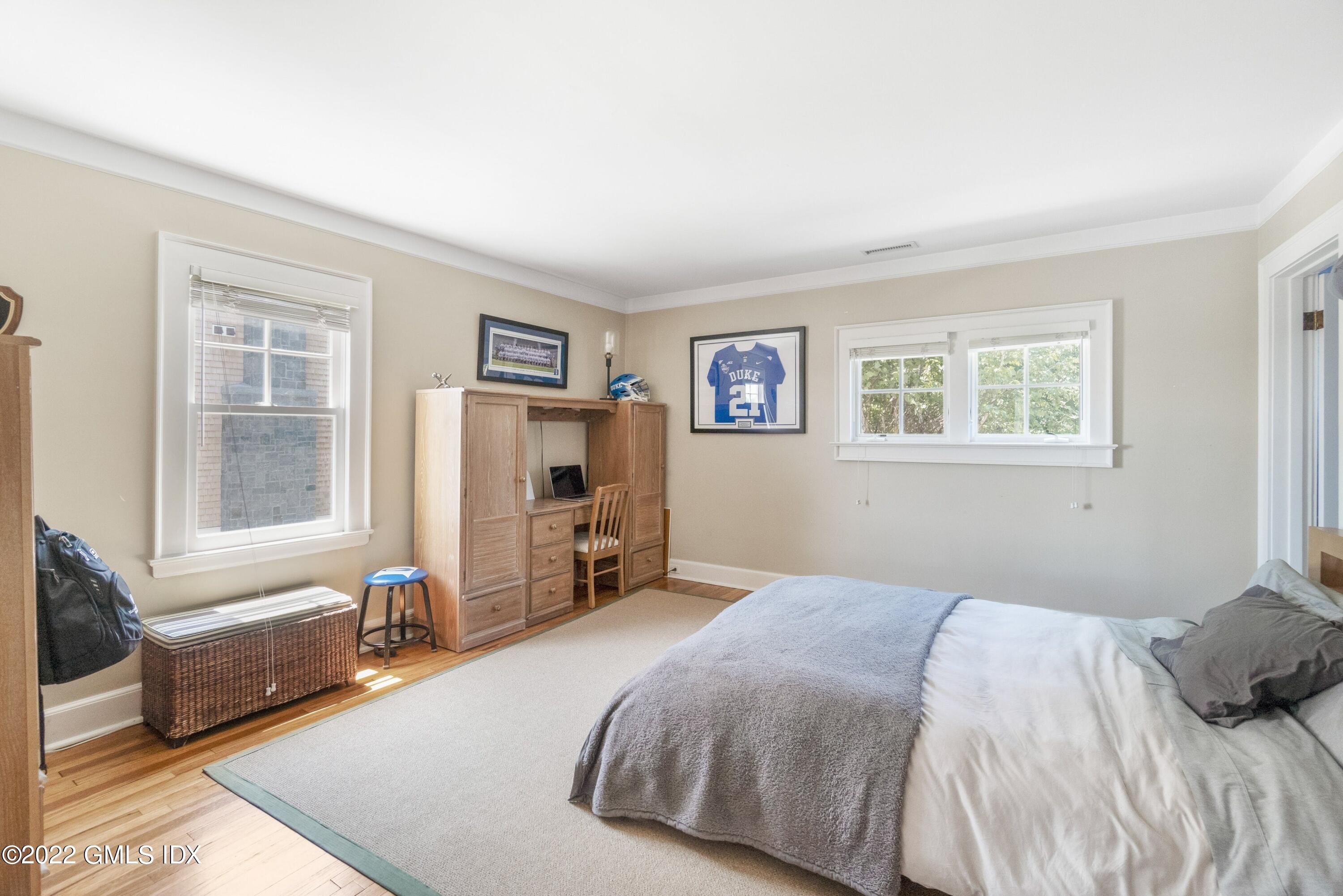 27 Willowmere Circle Riverside, CT 06878 - Photo 23 of 33 a bedroom with a bed and a couch