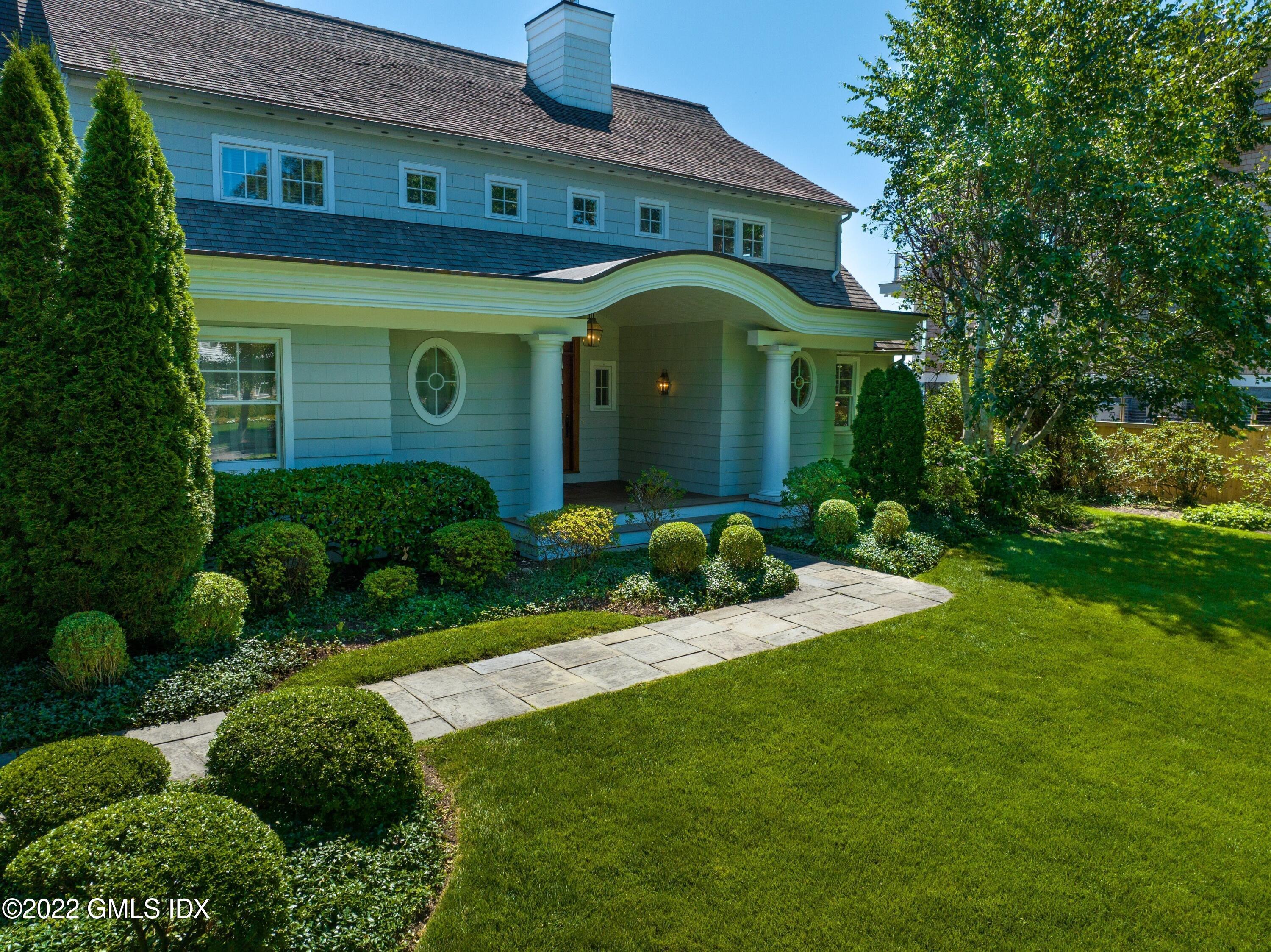 27 Willowmere Circle Riverside, CT 06878 - Photo 3 of 33 a front view of a house with garden