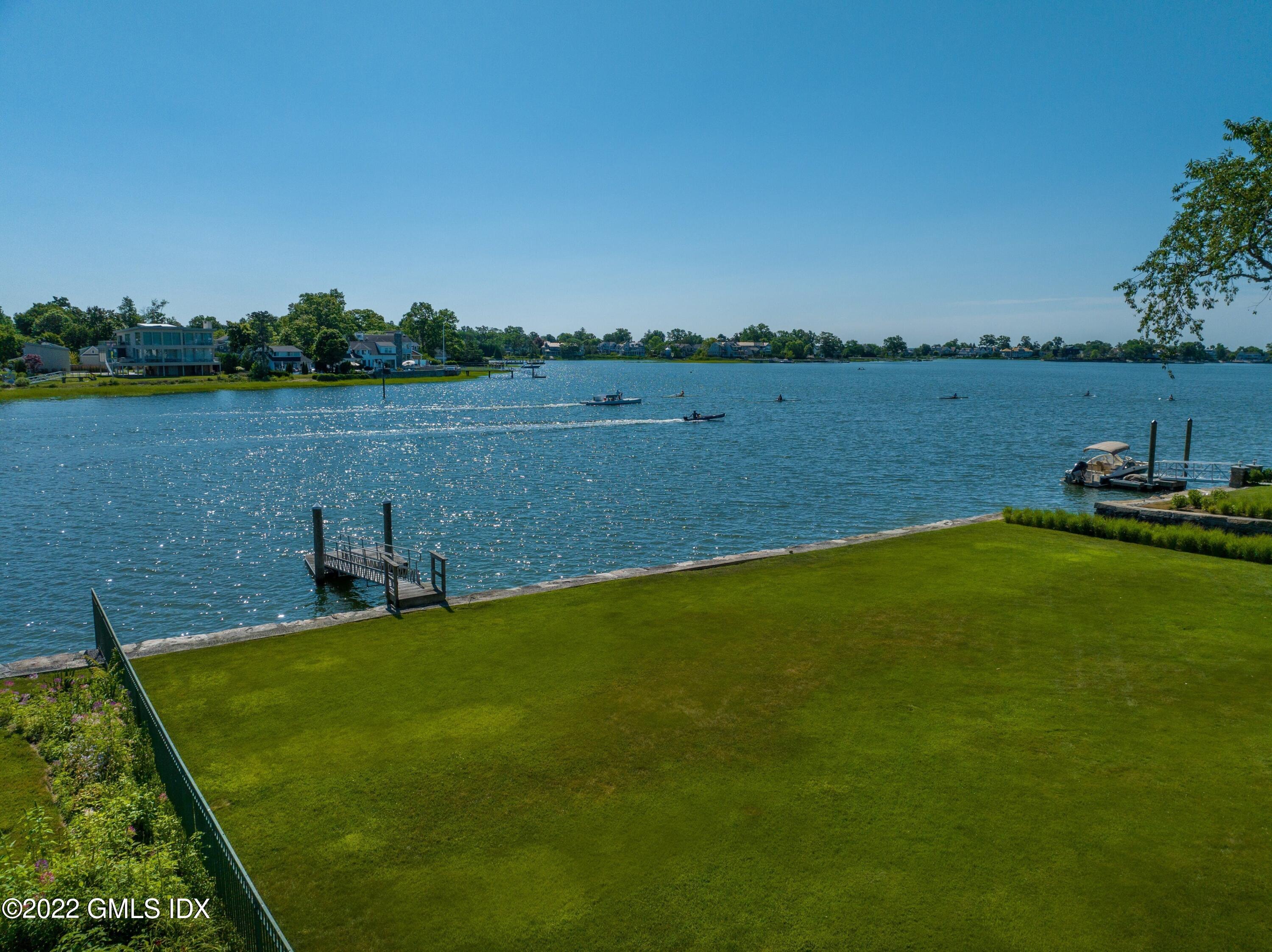 27 Willowmere Circle Riverside, CT 06878 - Photo 4 of 33 a view of a lake with houses in the back