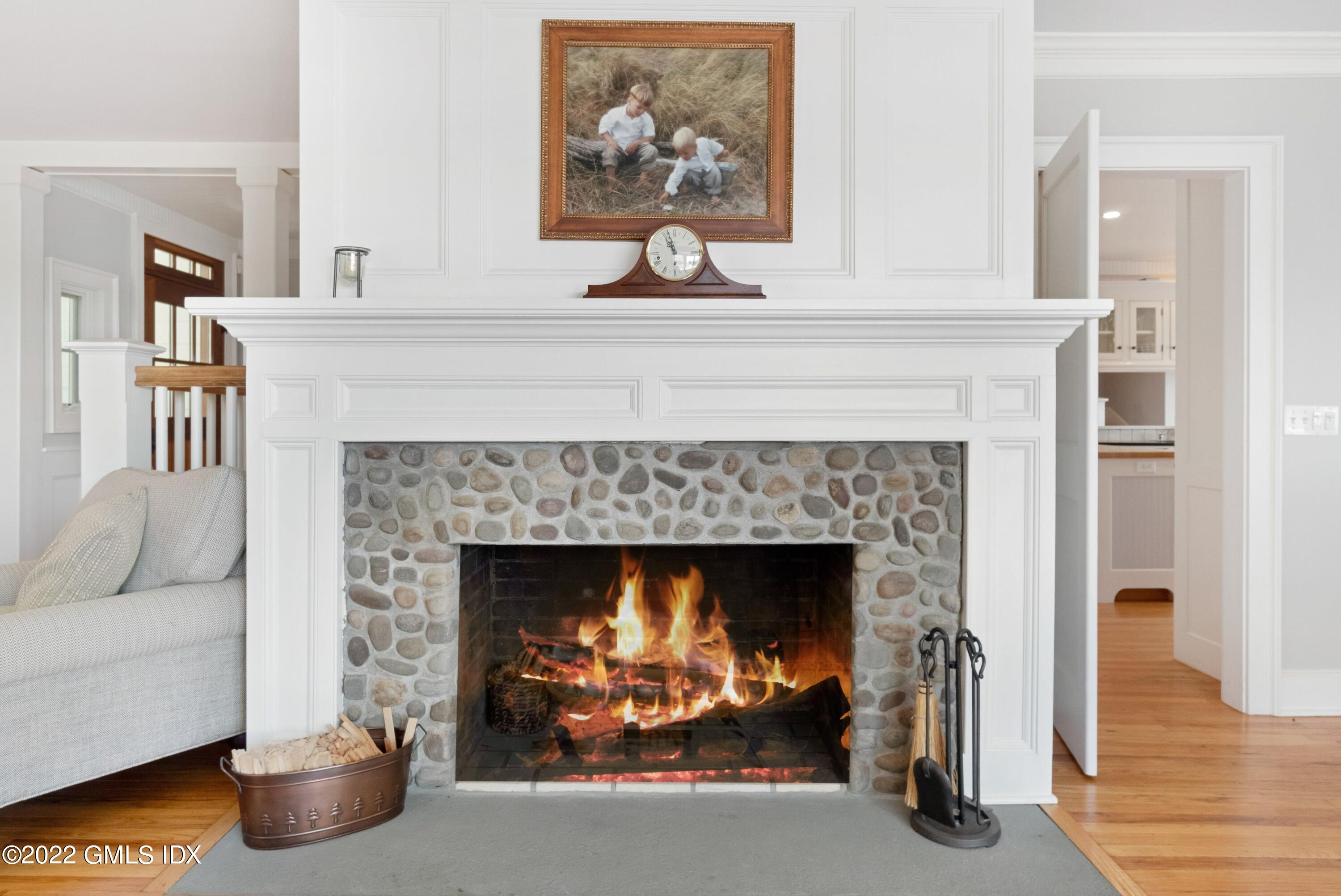 27 Willowmere Circle Riverside, CT 06878 - Photo 10 of 33 a living room with furniture and a fireplace