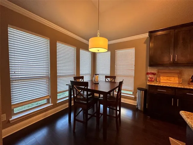 a dining room with furniture and window