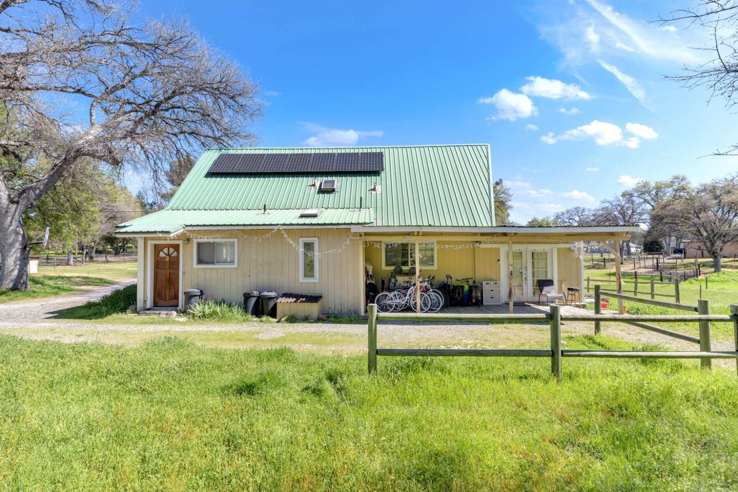 13489 Yorkshire Road Groveland, CA 95321 - Photo 29 of 35 a view of a house with a yard porch and sitting area