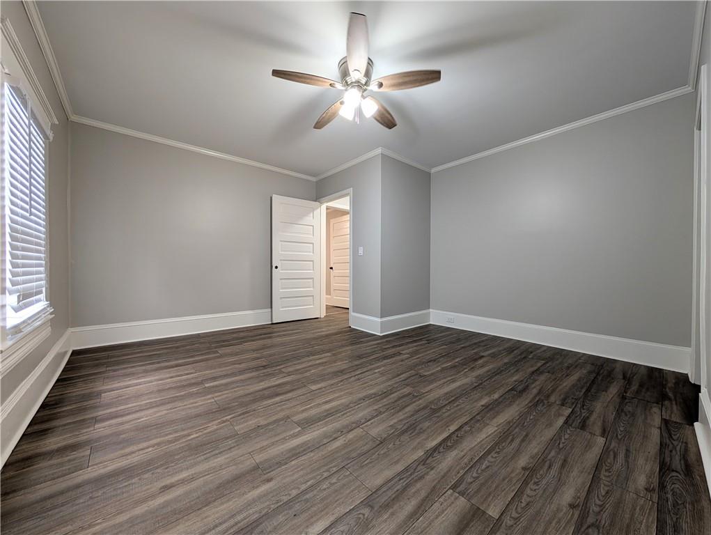 1716 Thompson Avenue Atlanta, GA 30344 - Photo 18 of 27 wooden floor in an empty room with a window