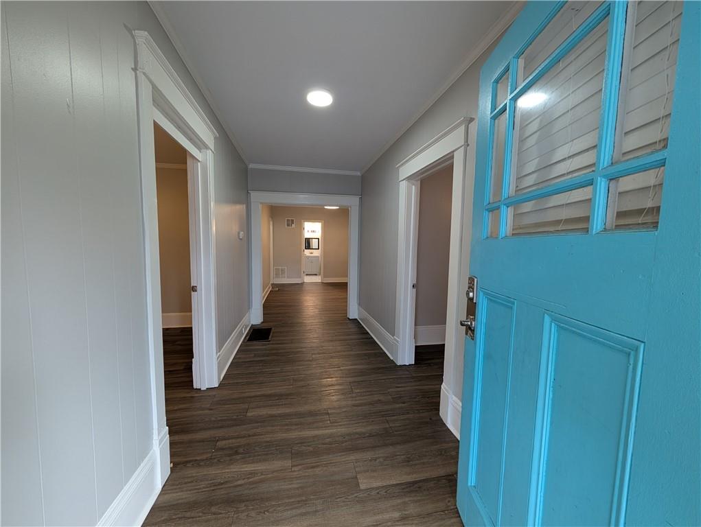1716 Thompson Avenue Atlanta, GA 30344 - Photo 4 of 27 a view of a hallway with wooden floor