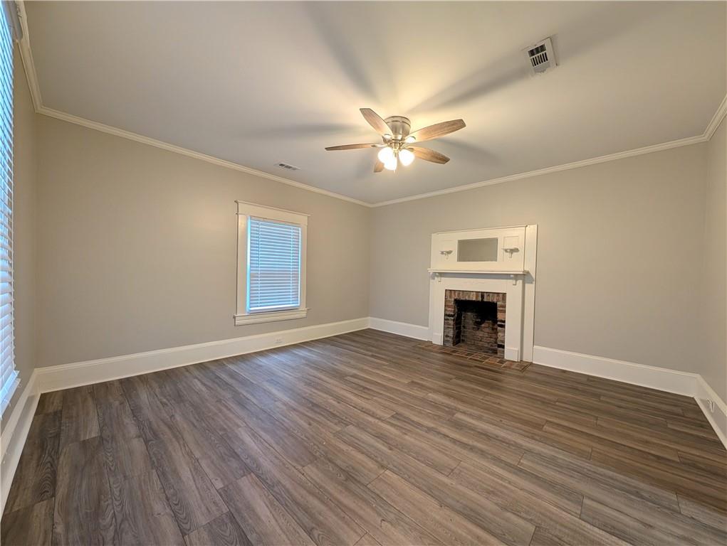 1716 Thompson Avenue Atlanta, GA 30344 - Photo 5 of 27 a view of empty room with fireplace and wooden floor