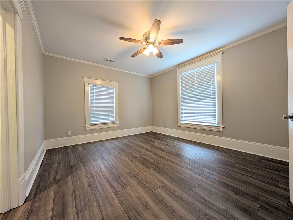 1716 Thompson Avenue Atlanta, GA 30344 - Photo 7 of 27 a view of an empty room with wooden floor and a window