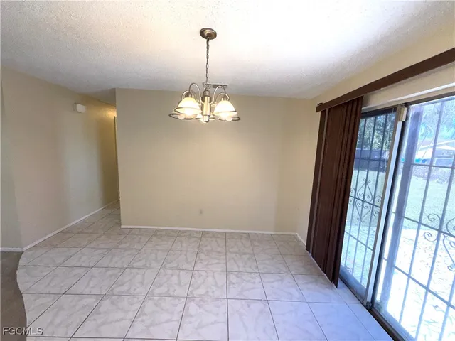 a view of entryway with window and chandelier