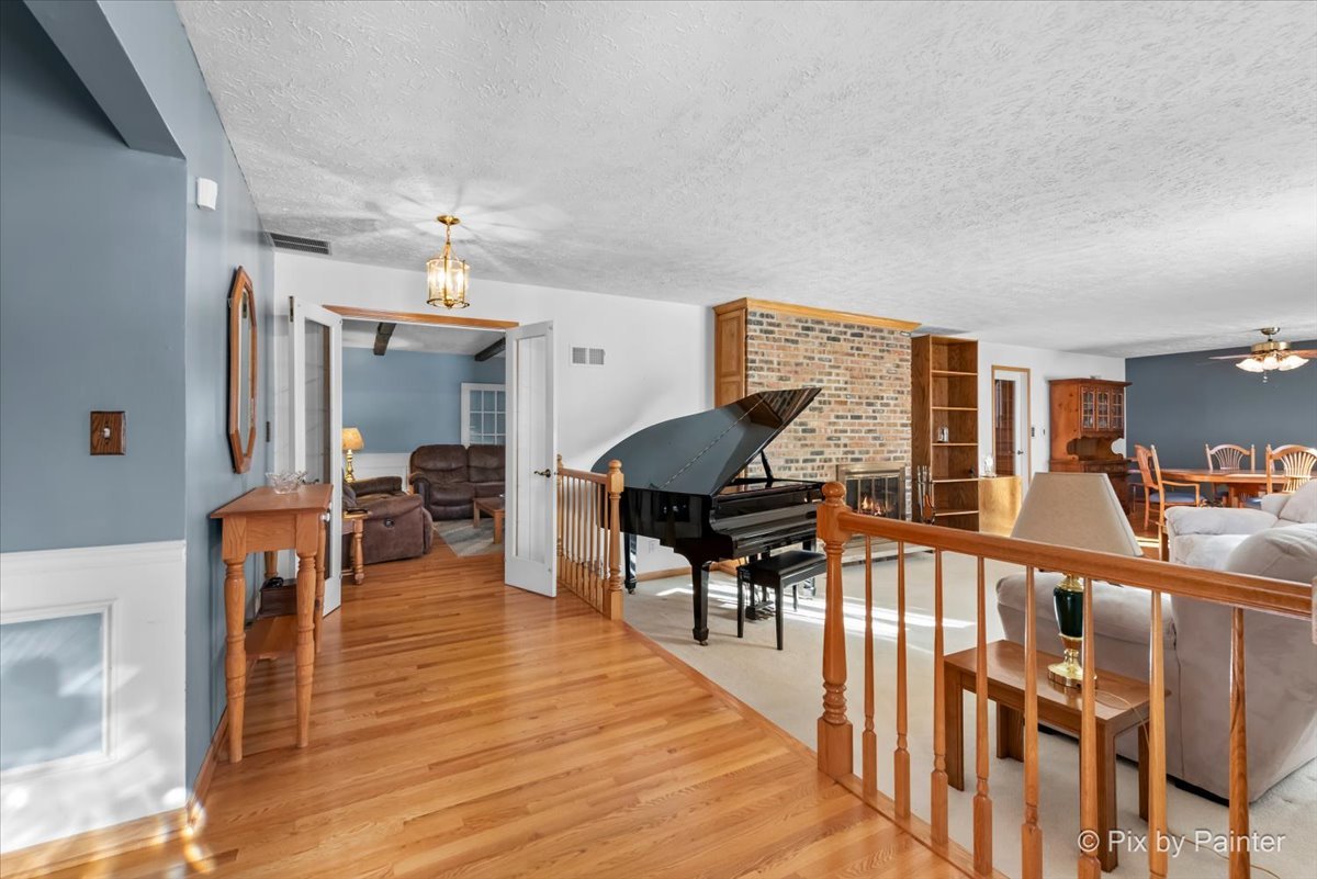 64 48w916 Il Route Maple Park, IL 60151 - Photo 3 of 62 a livingroom with furniture a rug and wooden floor