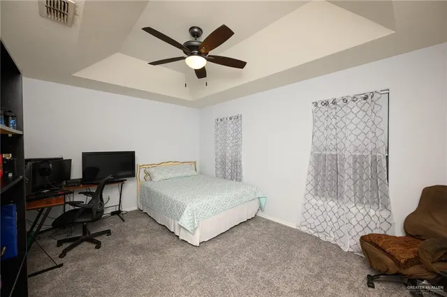 a bedroom with a bed furniture and a window