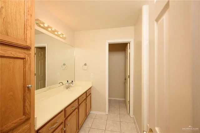 a bathroom with a double vanity sink and mirror