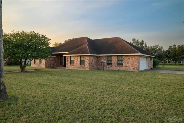 a front view of house with garden