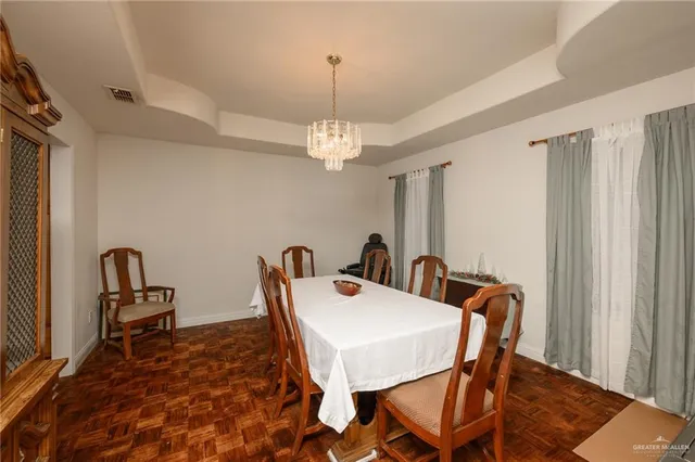 a view of a dining room with furniture and window