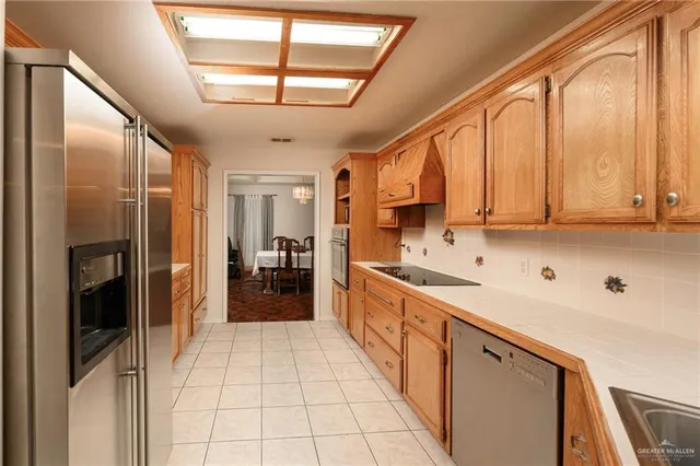 a large kitchen with a large window