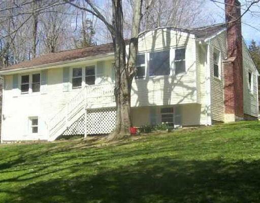 11 Rock Spring Lane Ridgefield, CT 06877 - Photo 1 of 1 a front view of a house with a yard