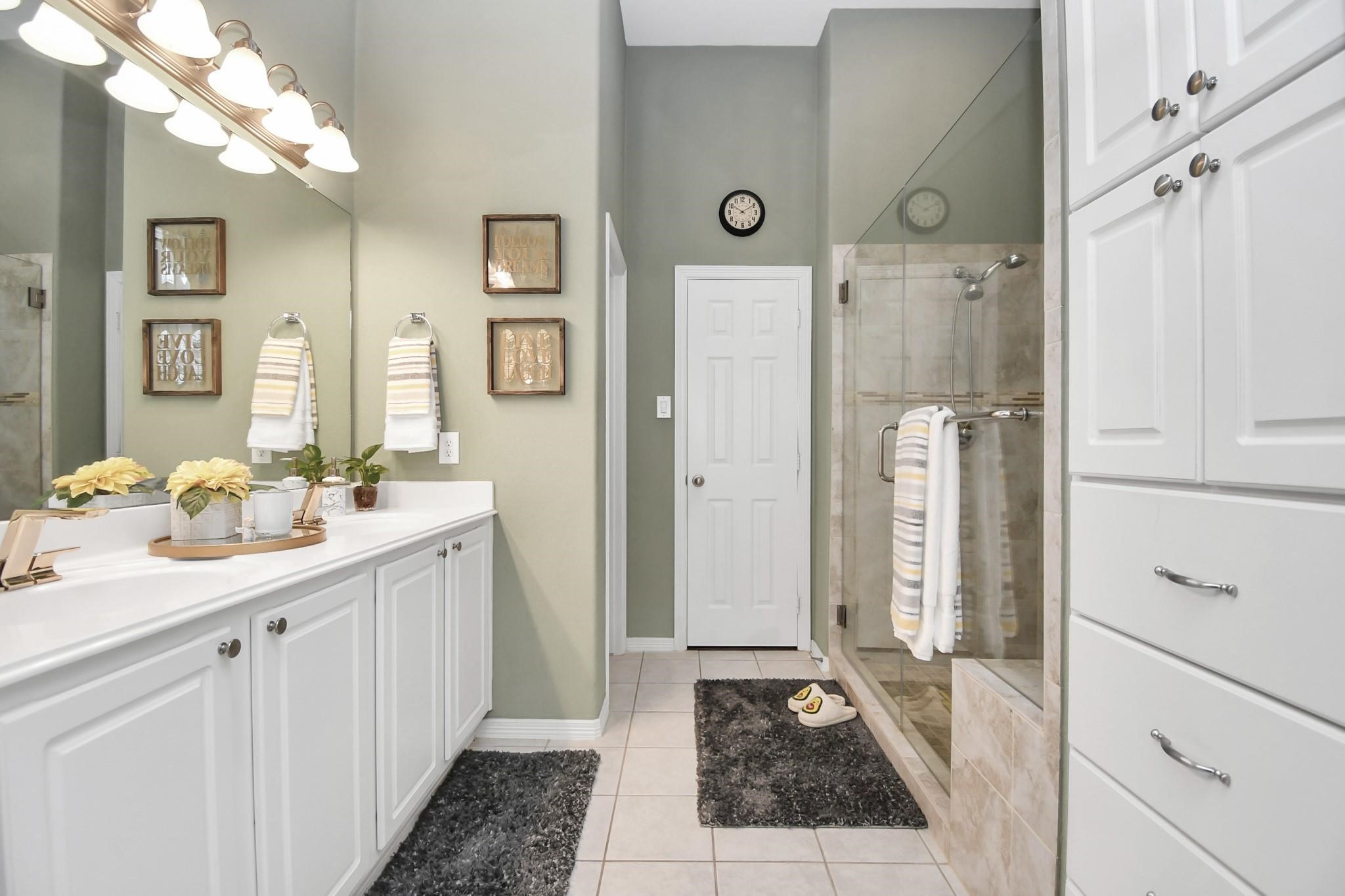 8624 Sunset Loch Drive Spring, TX 77379 - Photo 22 of 44 a bathroom with a sink and a mirror