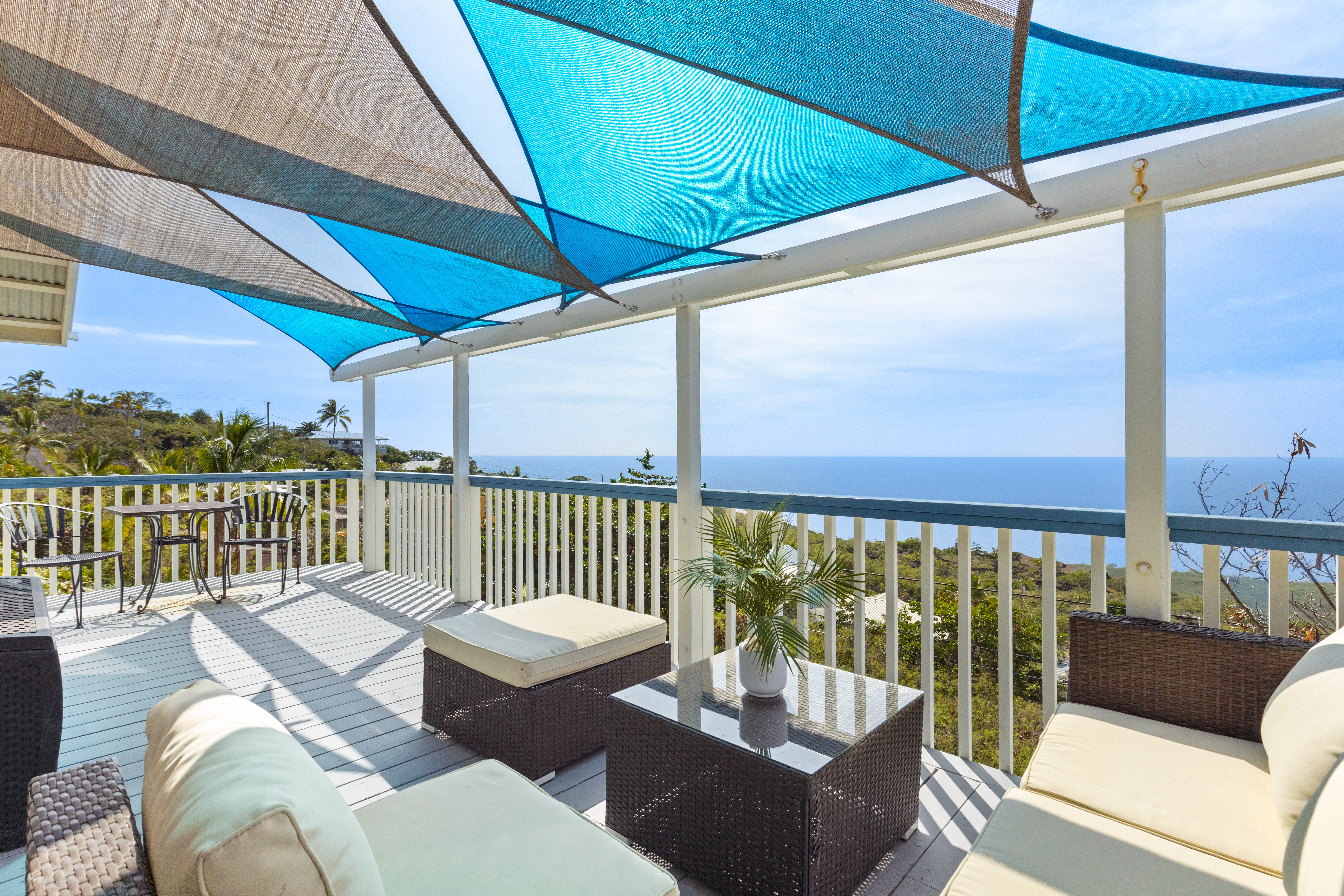 a balcony with furniture and city view