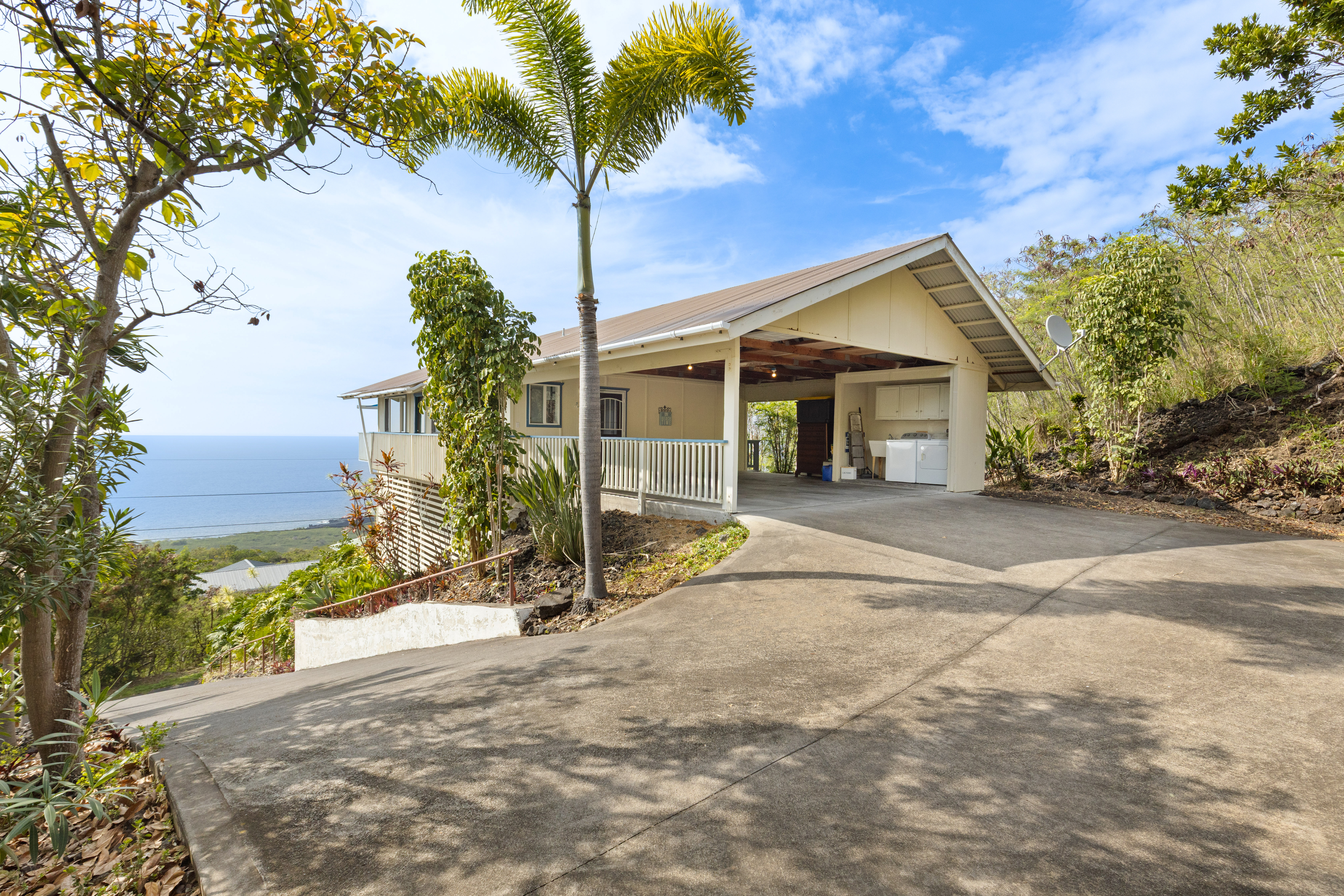 87-3210 Rd G Captain Cook, HI 96704 - Photo 20 of 22 a view of a house with backyard and trees
