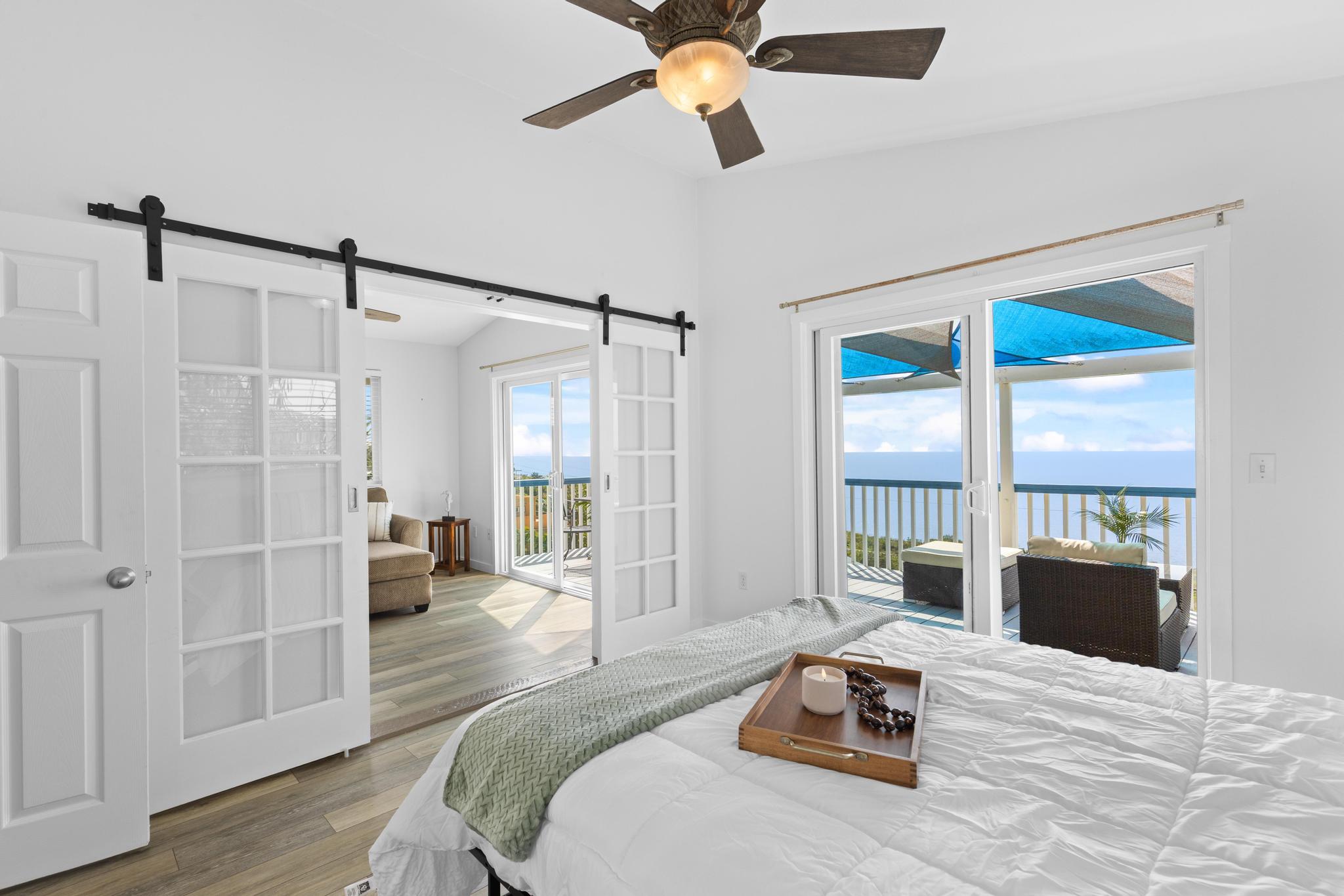 87-3210 Rd G Captain Cook, HI 96704 - Photo 8 of 22 a bedroom with a bed and a large window
