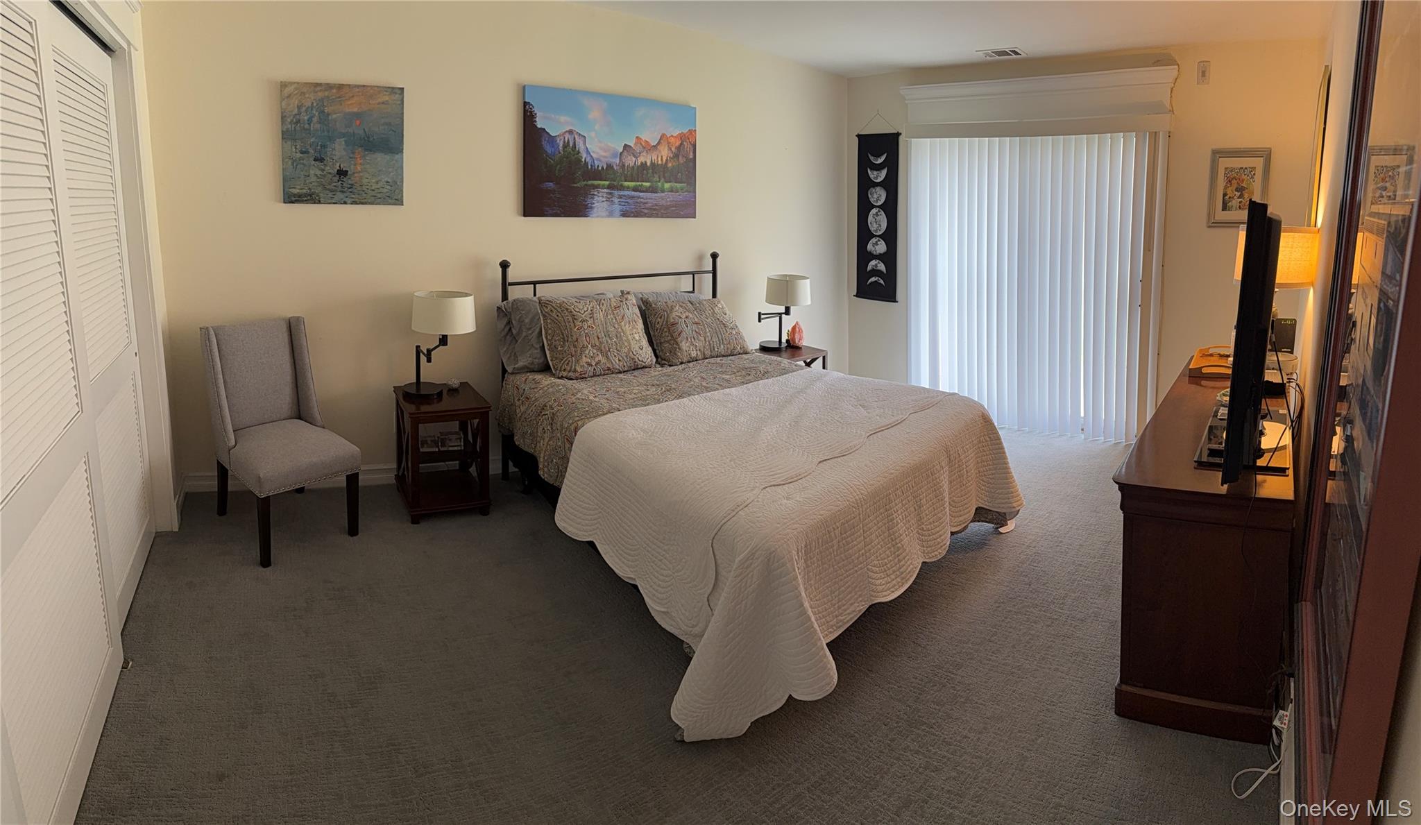 61 Rocky Point Yaphank Road, Unit 61 Rocky Point, NY 11778 - Photo 5 of 12 a bedroom with bed and a dresser