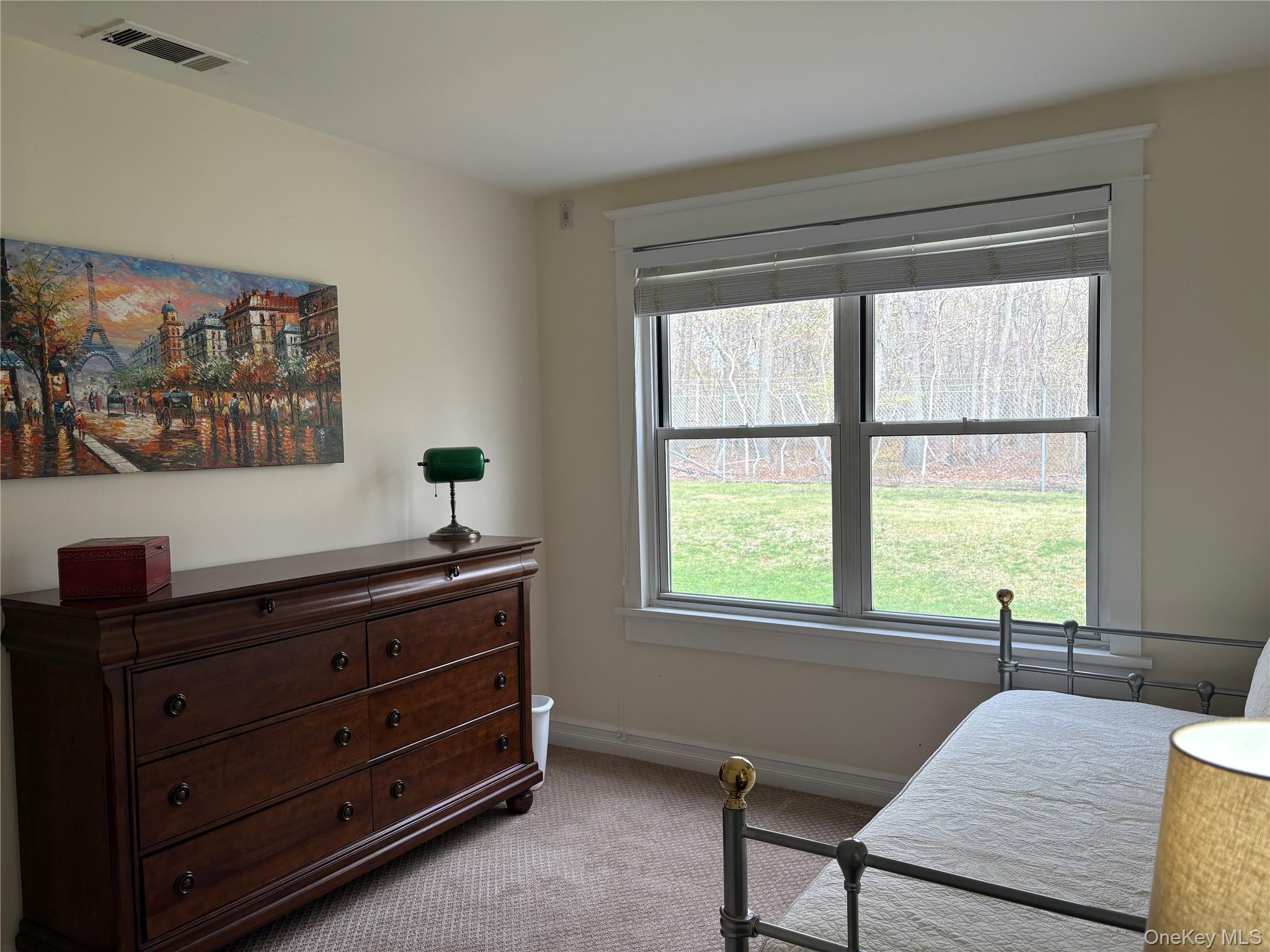 61 Rocky Point Yaphank Road, Unit 61 Rocky Point, NY 11778 - Photo 7 of 12 a living room with furniture and a window