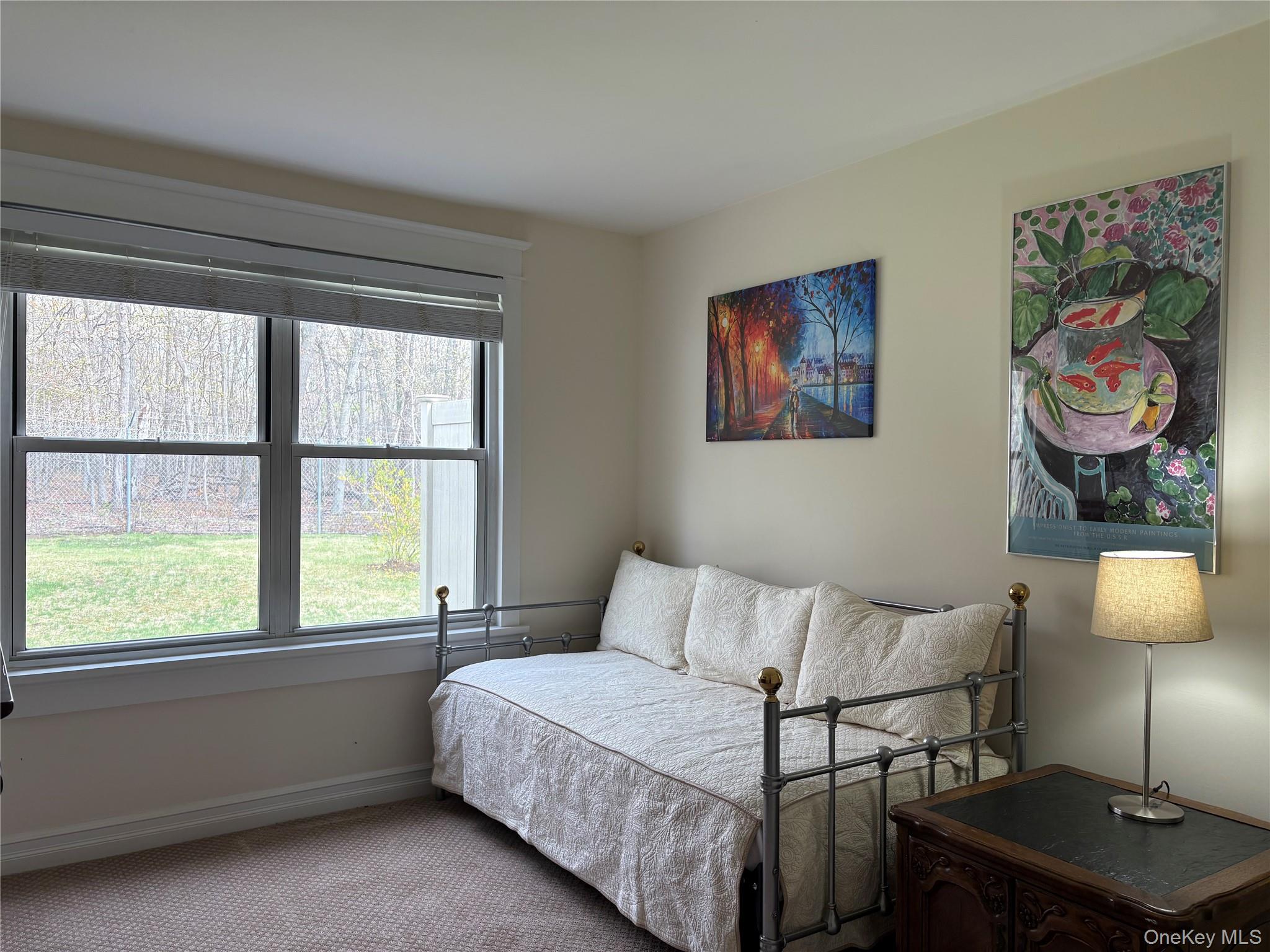 61 Rocky Point Yaphank Road, Unit 61 Rocky Point, NY 11778 - Photo 8 of 12 a bedroom with a bed and window