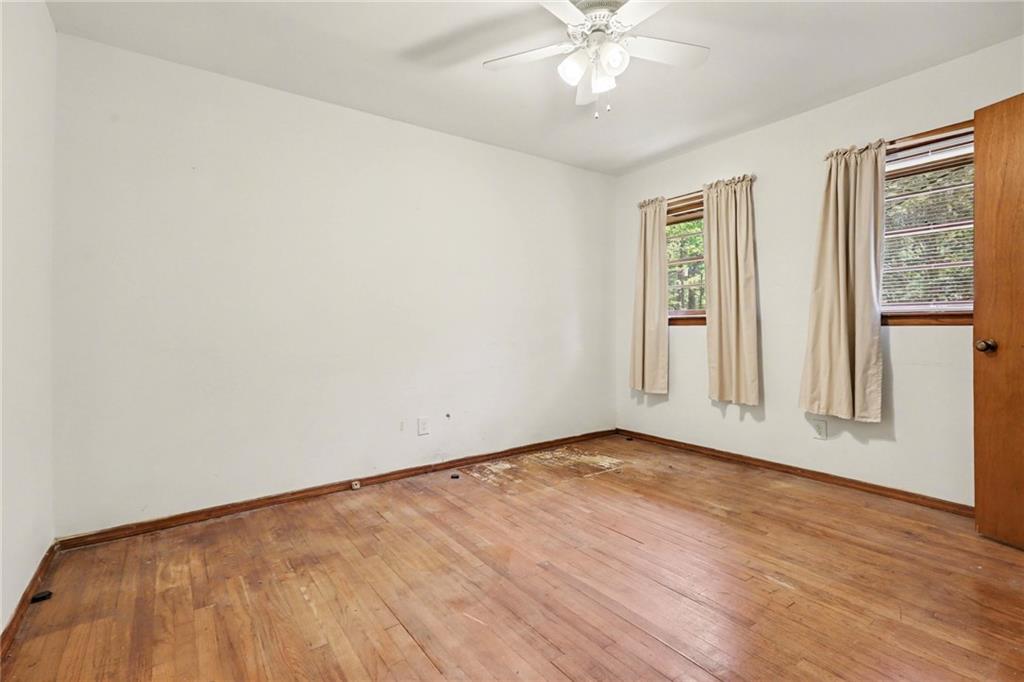 7019 Lake View Lane Doraville, GA 30360 - Photo 15 of 32 a view of an empty room with wooden floor and a window