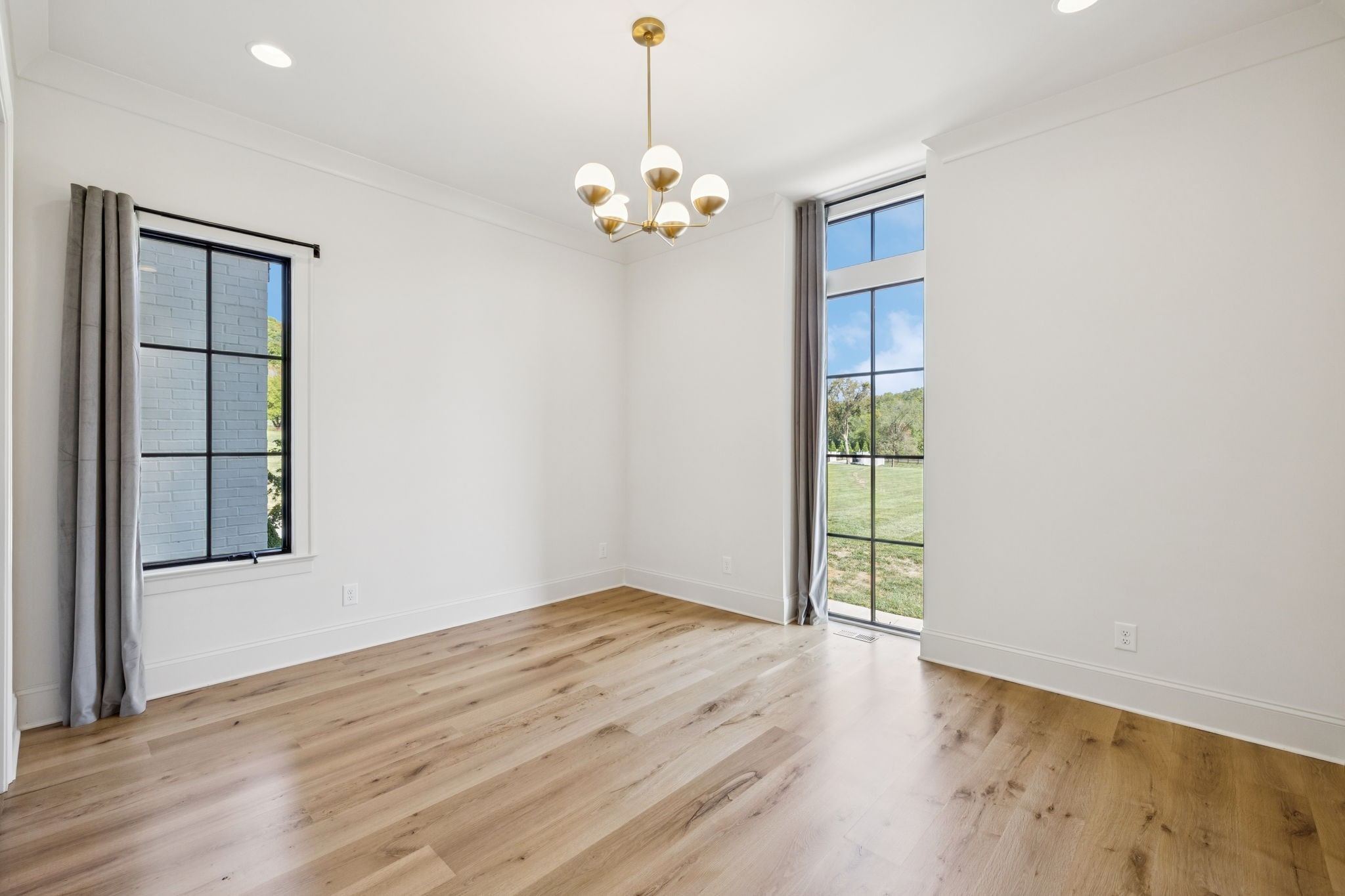 2245 Skinner Road Arrington, TN 37014 - Photo 26 of 98 a view of an empty room with a window and wooden floor