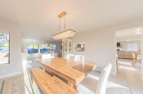 a view of a patio with couches and potted plants