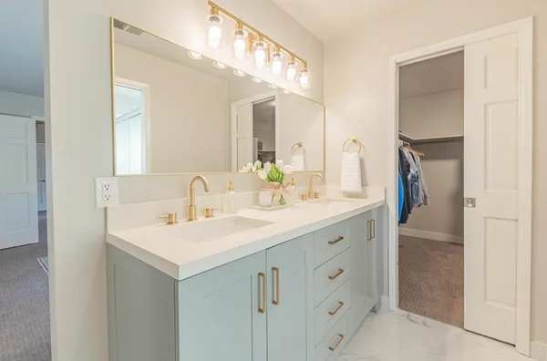 a bedroom with a bed and a couch