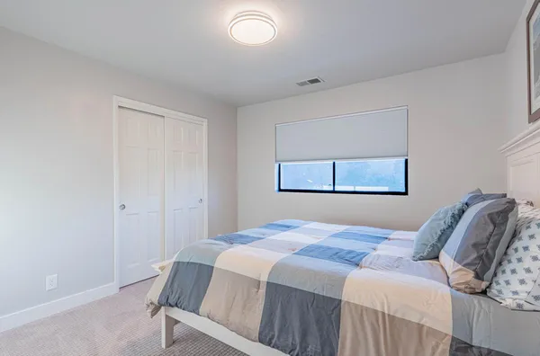 a view of backyard with swimming pool and sitting space