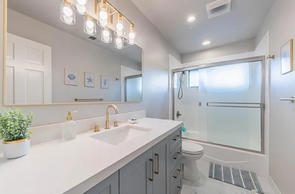 a balcony with wooden floor and city view