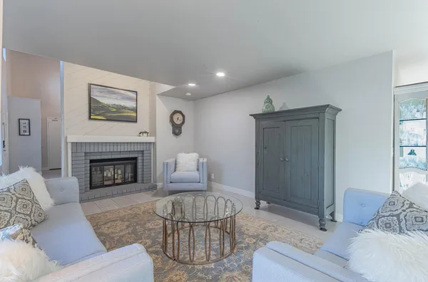 a living room with furniture and a table