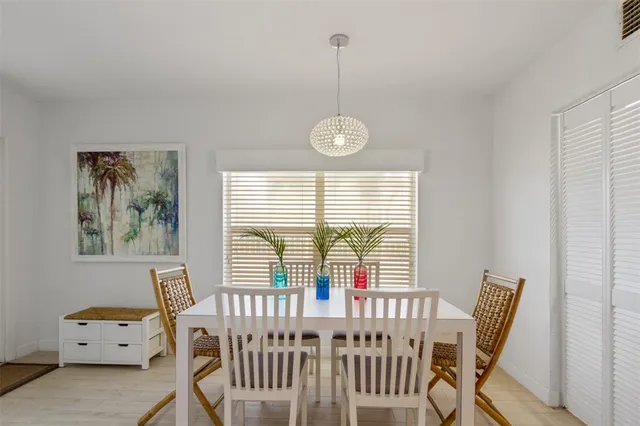 a view of a dining room with furniture and a window