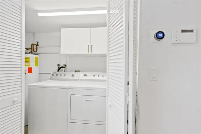 a bathroom with a tub shower and sink