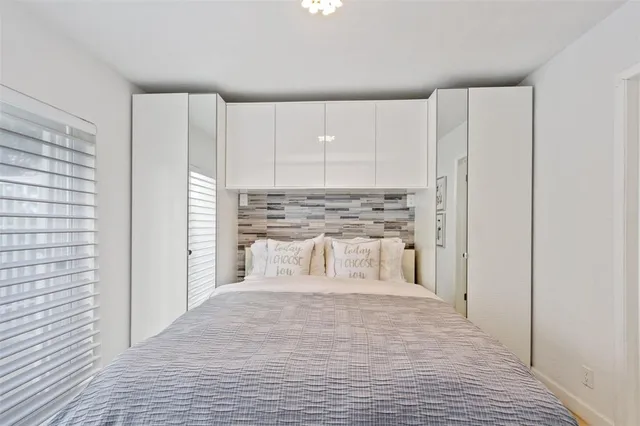 a bathroom with a shower and a sink