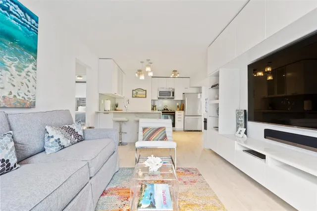 a living room with furniture and flat screen tv