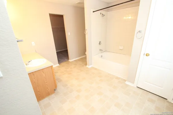 a bathroom with a bathtub sink and toilet