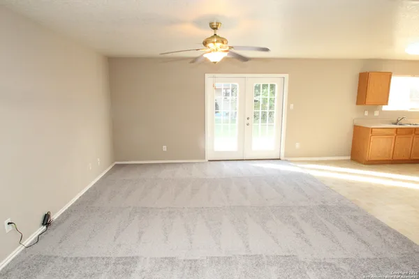 a view of an empty room with a window