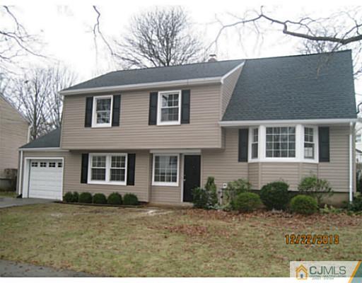 24 Hill Road Edison, NJ 08817 - Photo 1 of 16 a front view of a house with a yard