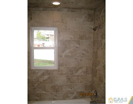 24 Hill Road Edison, NJ 08817 - Photo 14 of 16 a bathroom with a window