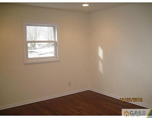 24 Hill Road Edison, NJ 08817 - Photo 15 of 16 an empty room with a window