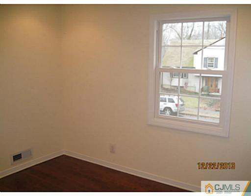 24 Hill Road Edison, NJ 08817 - Photo 16 of 16 an empty room with a window