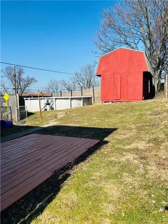 a view of a yard with an outdoor space