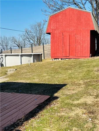 a view of a pool with a house