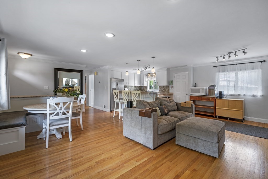 6 Ames Road Marblehead, MA 01945 - Photo 14 of 32 a living room with furniture wooden floor and kitchen view