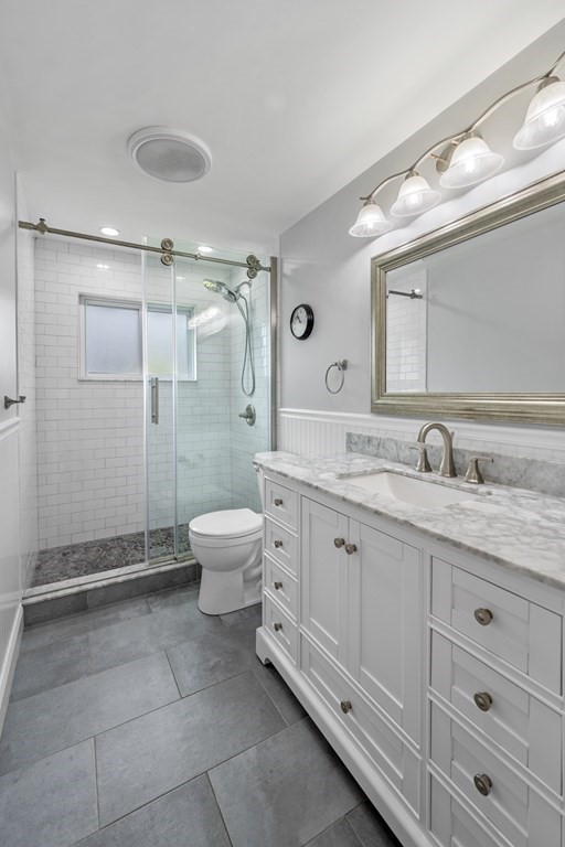 6 Ames Road Marblehead, MA 01945 - Photo 16 of 32 a bathroom with a granite countertop sink toilet and shower