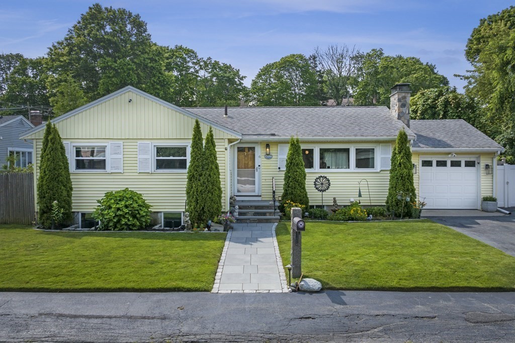 6 Ames Road Marblehead, MA 01945 - Photo 2 of 32 a front view of a house with a yard and garage