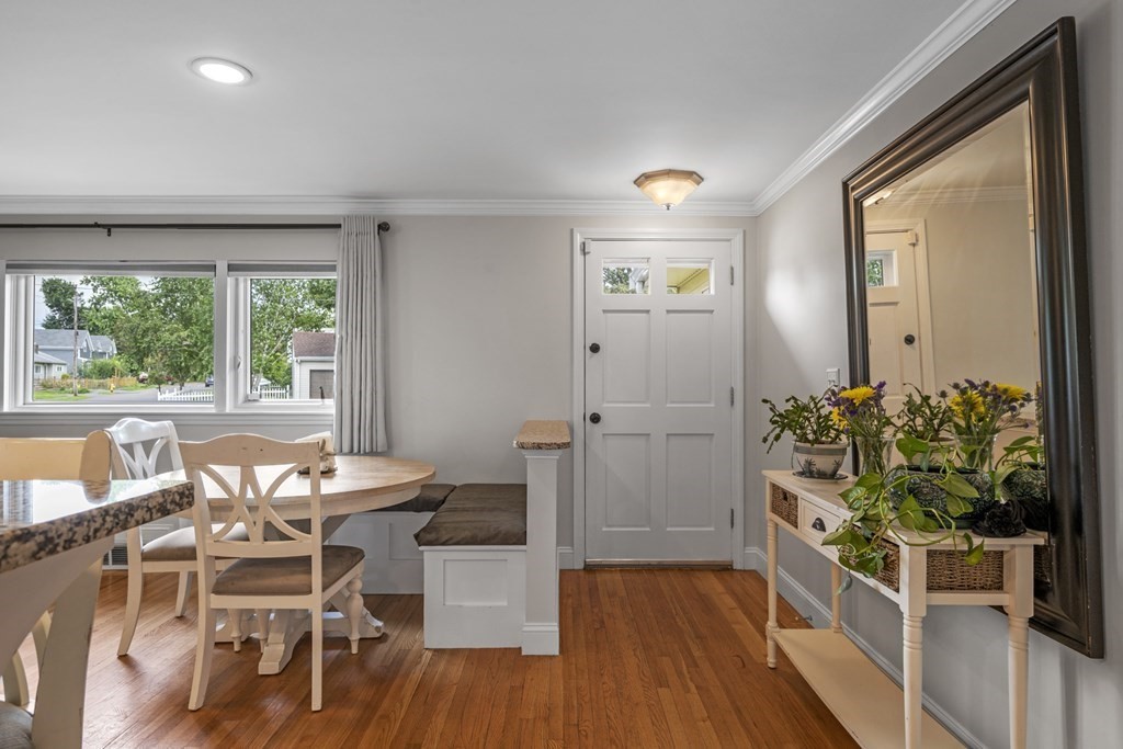 6 Ames Road Marblehead, MA 01945 - Photo 9 of 32 a dining room with furniture potted plants and wooden floor