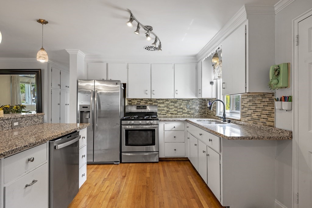 6 Ames Road Marblehead, MA 01945 - Photo 10 of 32 a kitchen with stainless steel appliances granite countertop a sink stove and refrigerator