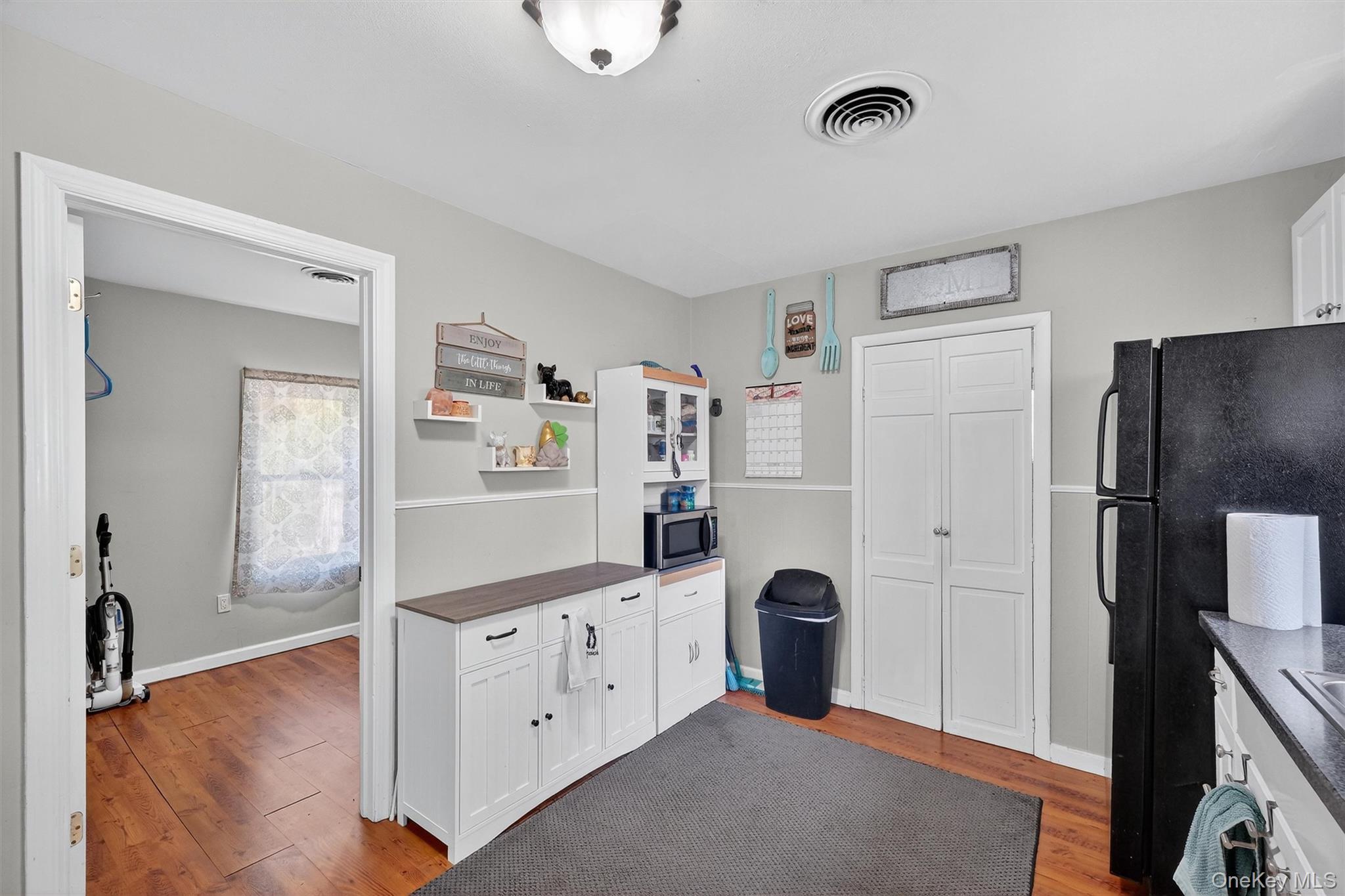 27 Peckham Road Poughkeepsie, NY 12603 - Photo 11 of 27 a kitchen with stainless steel appliances a refrigerator and a stove top oven